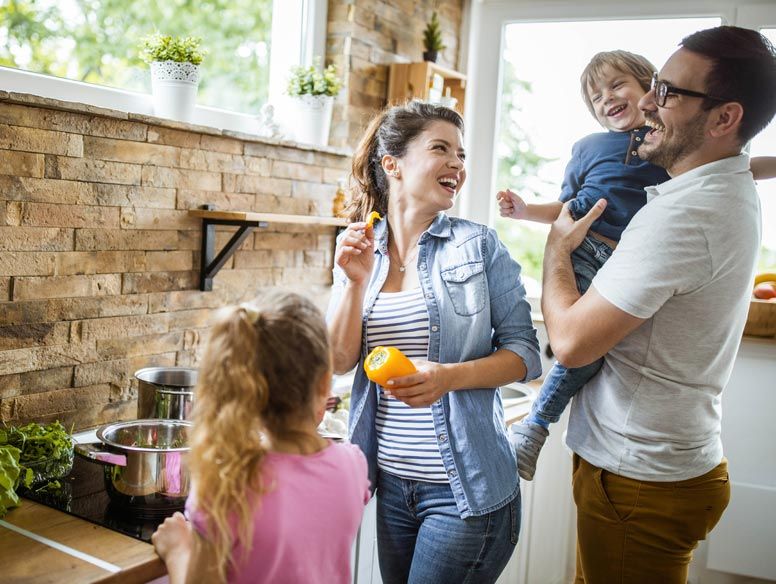 Smiling family cooking together