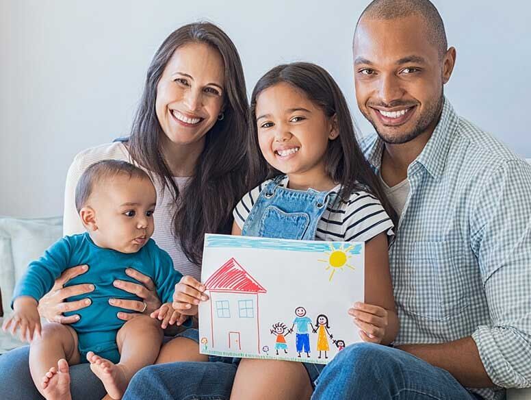 Smiling father, mother and two children